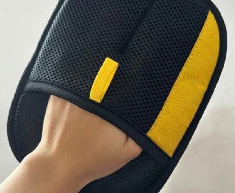 Hand inside the Furvia glove showing the black mesh and yellow trim